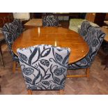Modern yew wood extending dining table and six chairs. Condition reports are not availabe for our