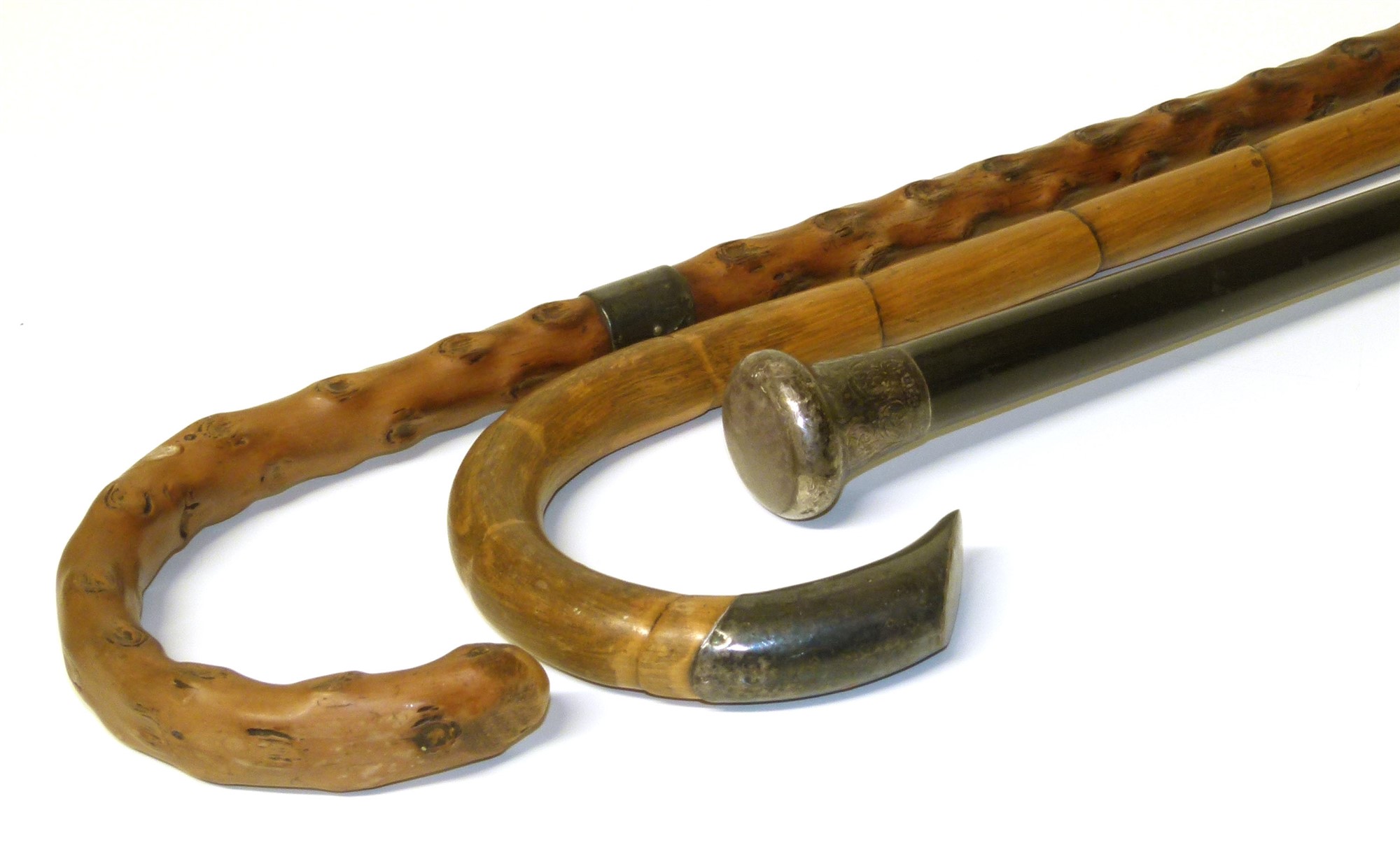 Three silver topped walking canes Condition reports are not availabe for our Interiors Sales.