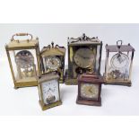 Six assorted brass table clocks including four torsion clocks Condition reports are not availabe for