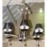 Modern six branch centre light with chrome frame, black shades and glass dropper. Condition