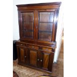 Late Victorian mahogany two door bookcase on base, three cupboards and three drawers to base,