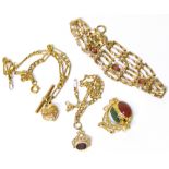 9ct Gold garnet set bracelet, 9ct gold hardstone pendant and two other 9ct gold chains and pendants.