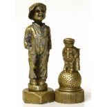 Two brass car mascots "Dunlop" and "The Kid". Condition reports are not availabe for our Interiors