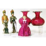 A pair of cranberry glass vases and three continental porcelain figures Condition reports are not