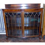 Early 20th century mahogany two-door display cabinet on short cabriole legs Condition reports are