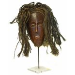 African Chokwe mask on stand, the mask measures 19cm high Condition reports are not availabe for our