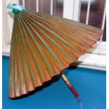 Green painted oriental parasol. Condition reports are not available for our Interiors Sales.