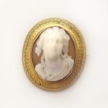 A Victorian cameo Etruscan style brooch Condition reports are not available for our Interiors
