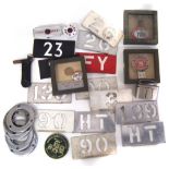 Collection of London bus related items, to include ten aluminum running number stencils, budget key,