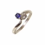 A diamond and sapphire 2-stone cross over platinum ring Condition reports are not available for