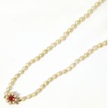 String of graduated pearls with garnet and pearl 9ct gold clasp Condition reports are not