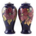 Pair of Moorcroft vase lamp bases, decorated with Clematis pattern, 27cm high For condition