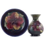 Moorcroft vase and a bowl , decorated with Hibiscus and Clematis patterns, impressed marks to