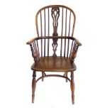 Early 19th century Windsor chair of yew and elm construction, high-back with pierced splat, solid
