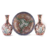 Japanese bowl and a pair vases, finely painted with elaborate Imari patterns, Meiji period (1868-