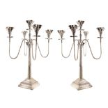 Pair of large silver plated candelabras , Corinthian columns with square stepped bases, four