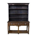 George III oak cottage dresser of unusually small proportions, top section with moulded cornice,