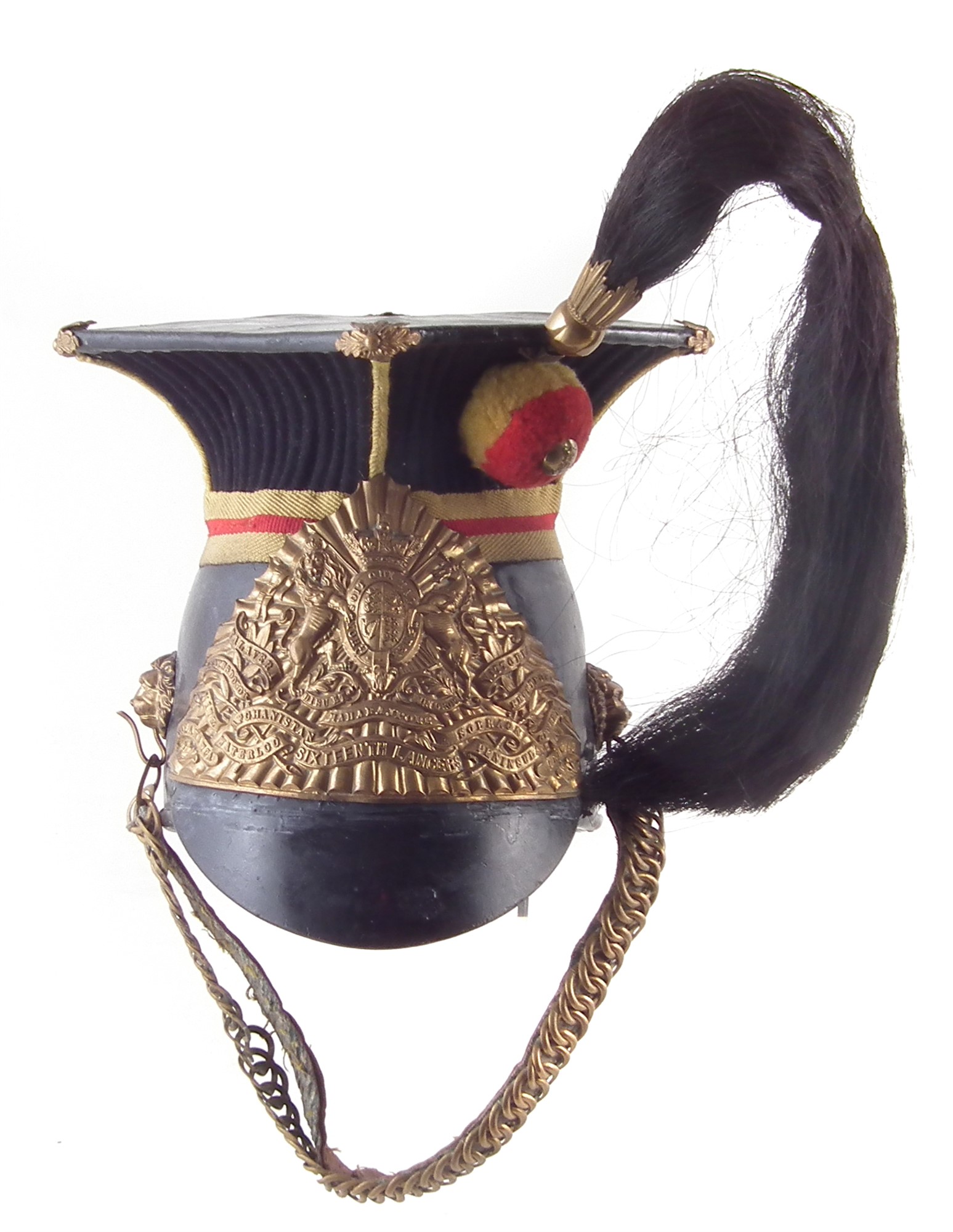 Sixteenth Lancers chapska helmet or lance cap , with elaborate front plate, below reeding and yellow