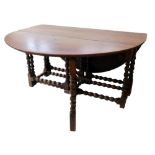 Late 18th century oak oval drop-leaf table, bobbin turned legs and stretchers with four gates, table