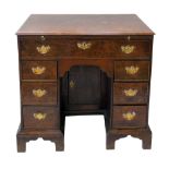 George III oak knee-hole desk, rectangular top above brushing slide one long drawer above two stacks