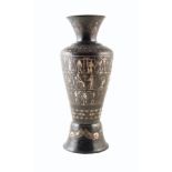 A 20th century oxidized copper vase with white metal overlay depicting scenes of Egyptian mythology.