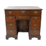 Late 18th century walnut knee-hole desk, quartered veneered top with cross-banding and herring