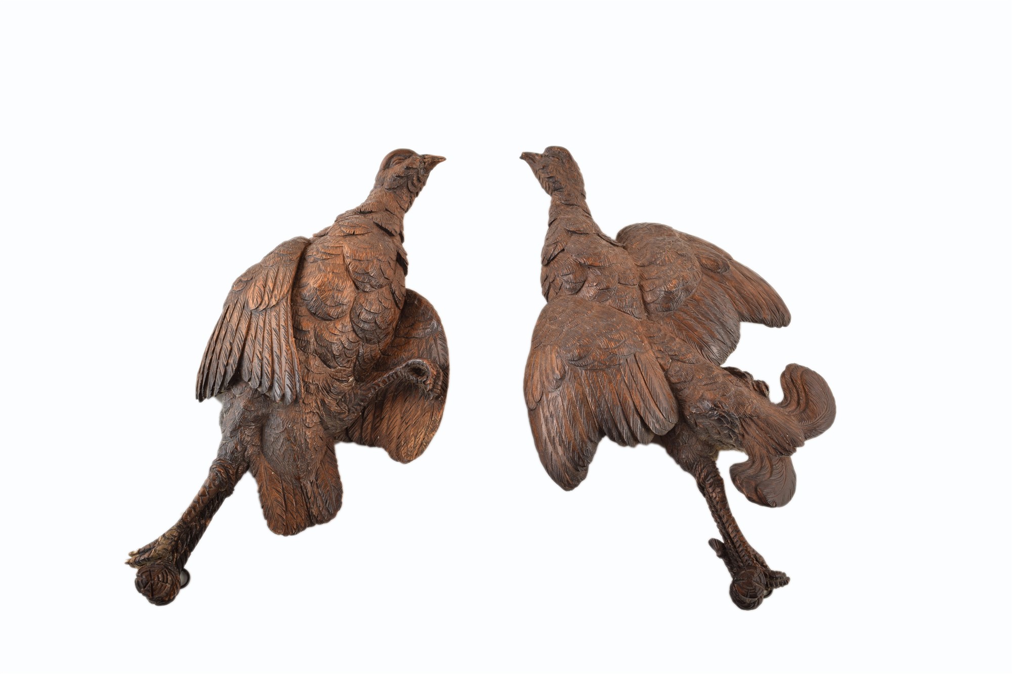 A pair of oak carved black forest hanging grouse. With wall hooks. 34 x 18.5 cm. For condition