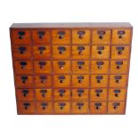 Late 19th century wall hanging mahogany thirty six drawer apothecary cabinet, each drawer with