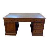 Victorian oak Partners desk, green leather inset, each side with one long and two short frieze