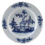 Rare Lowestoft plate circa 1770 , painted with a holed rock, fence and flowering plants, 23cm