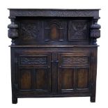 Mid 19th century oak court cupboard of 17th century design, top section with two single panel