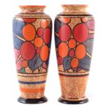 Two Clarice Cliff vases, decorated with Berries pattern on a Cafe Au Lait ground, 21cm high For