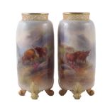 Pair of Royal Worcester vases by Harry Stinton, with pierced necks and raised on scrolling feet,
