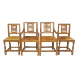 Four Robert "Mouseman" Thompson dining chairs, comprising of two single and two open-arm carvers,