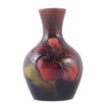 Moorcroft flambe vase, decorated with Hibiscus pattern, paper label to base, 9cm high For