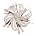 Platinum and diamond floral spray brooch , central round brilliant cut diamond weighing approx. 0.40