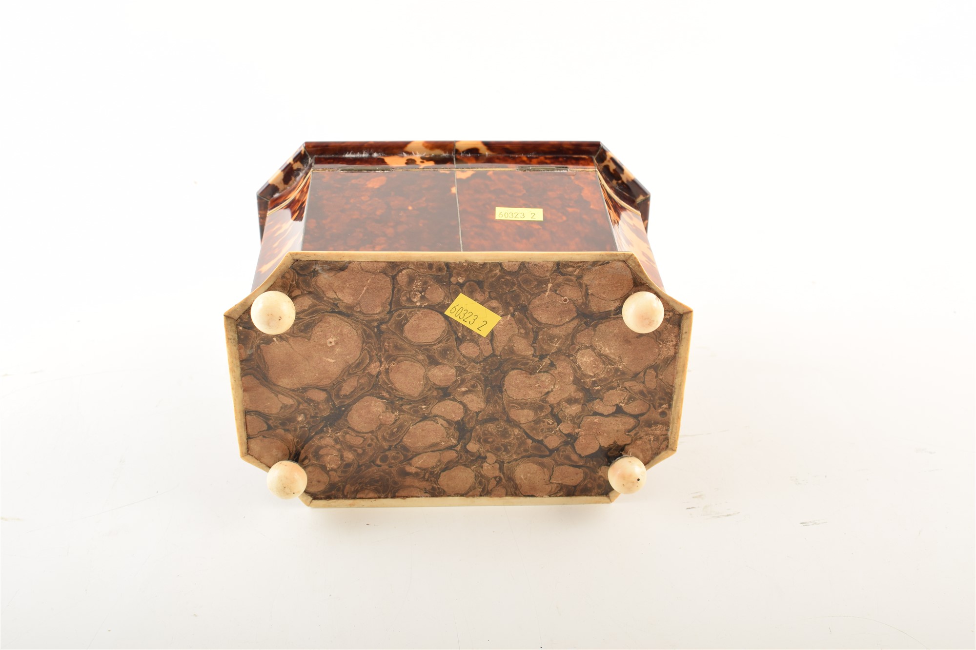A 19th century tortoiseshell veneered tea caddy. With caddy top and concave edges, on ivory feet - Image 4 of 5
