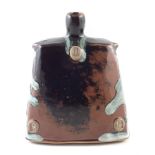 James Hake (1979-), a small stoneware bottle covered in nuka ash and tenmoku glaze, impressed JH