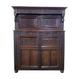 17th century oak court cupboard, over hanging top frieze decorated with stylised flowers and