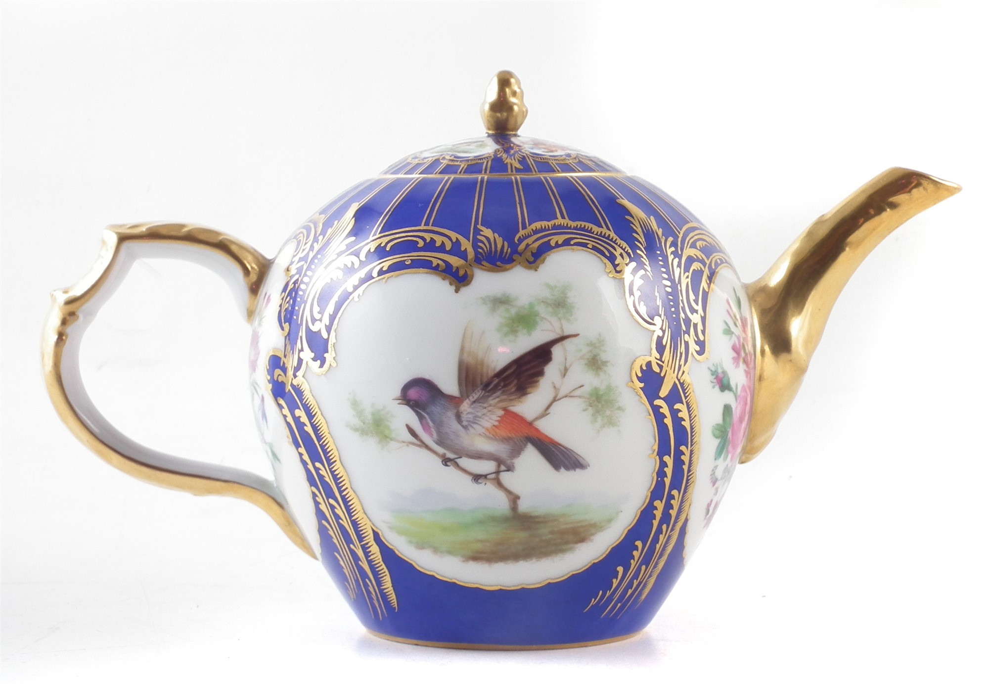 Berlin K.P.M teapot , of bullet shape, painted with birds in branches within cartouches on blue