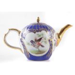 Berlin K.P.M teapot , of bullet shape, painted with birds in branches within cartouches on blue