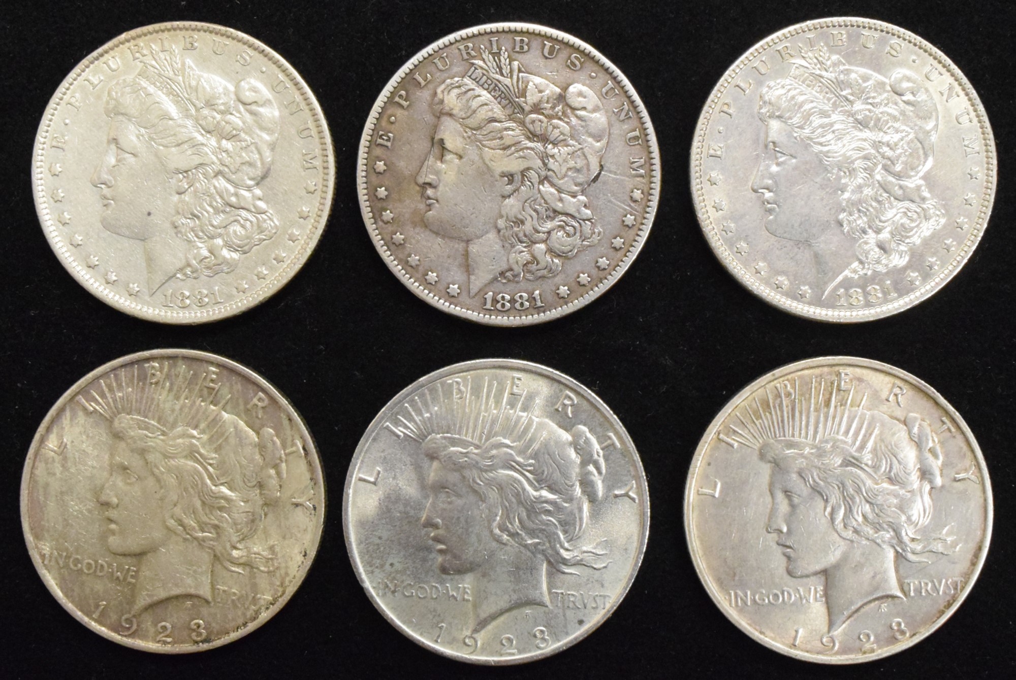 Six assorted USA silver Dollars (6).