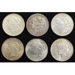 Six assorted USA silver Dollars (6).