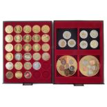 Two trays of gold-plated Queen Elizabeth II and reproduction coins.