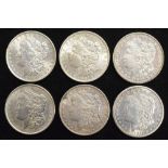 Six assorted USA silver Morgan Dollars (6).