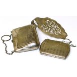 Two silver purses with engin turned decoration and a silver cake slice. Condition reports are not