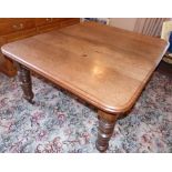 Late Victorian wind-out dining table on turned legs 139 x 119cm complete with two extra leaves.