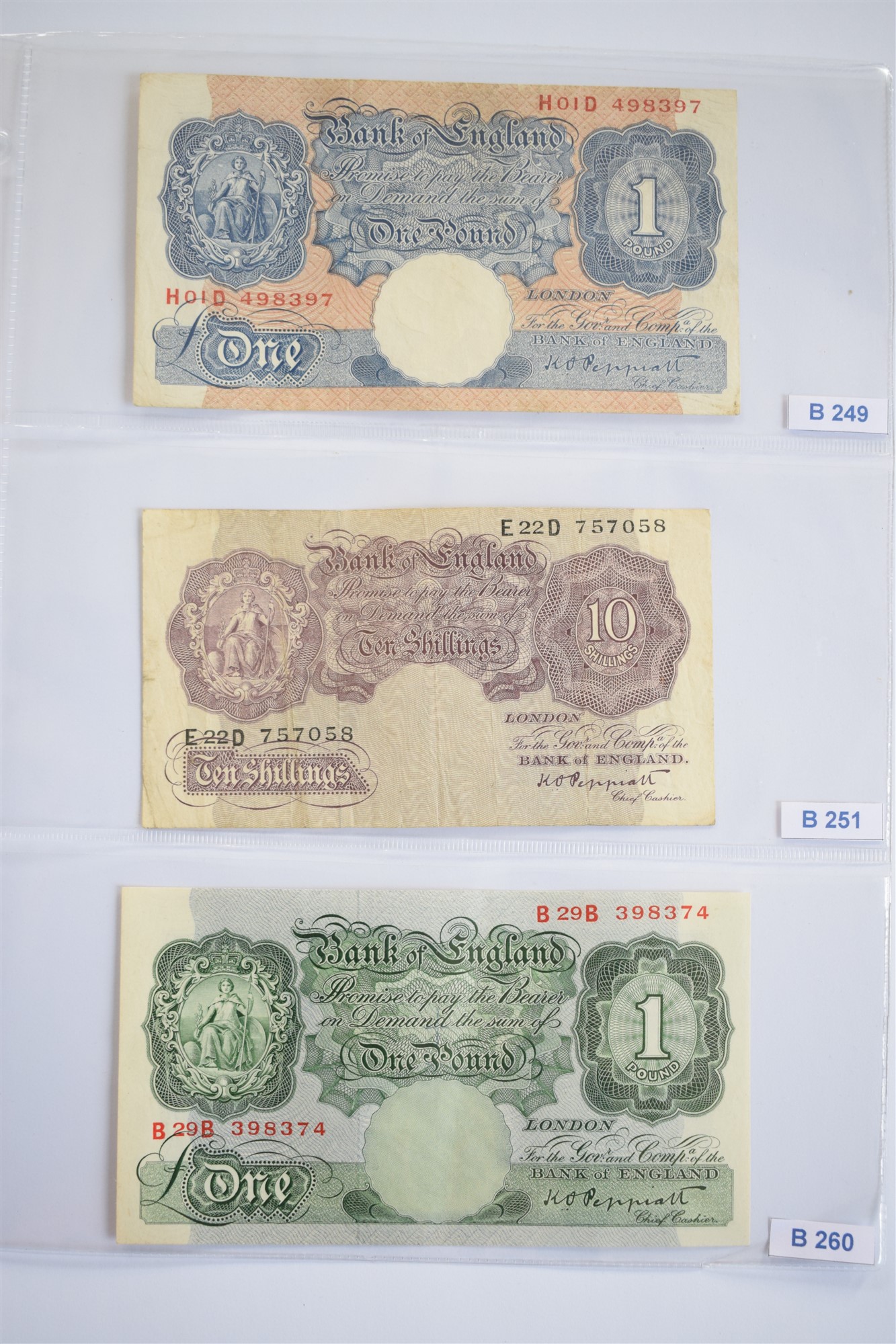 Two albums of British banknotes.