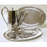 Assorted plain polished EPNS tableware including coffee pot, two oval dishes, and assorted knives