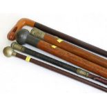 Two army swagger sticks, two South Lancashire Army walking sticks and one other walking cane